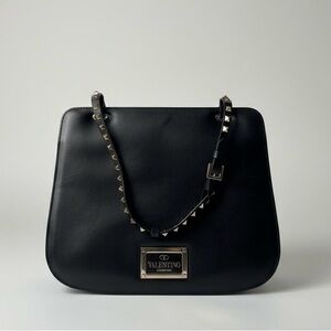 Valentino Garavani Rockstud black leather shoulder bag gold studs top handle